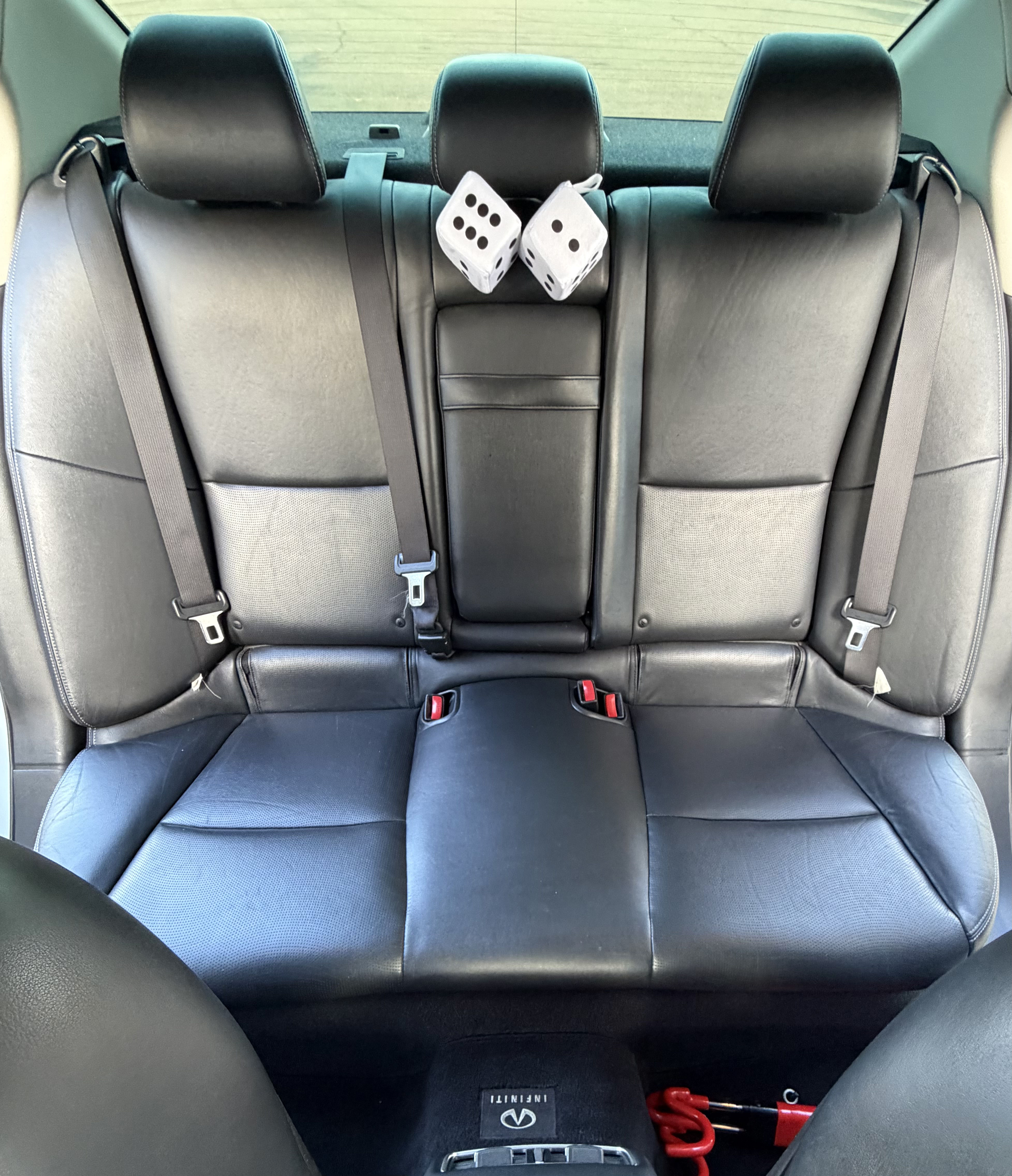 Immaculately detailed and vacuumed back passenger leather seats